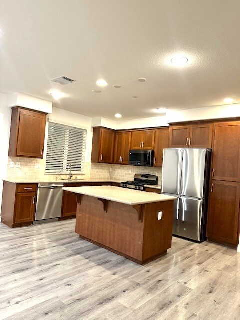 The Gourmet Kitchen with high-end brand new stainless steel Appliances - 276 Currlin Cir