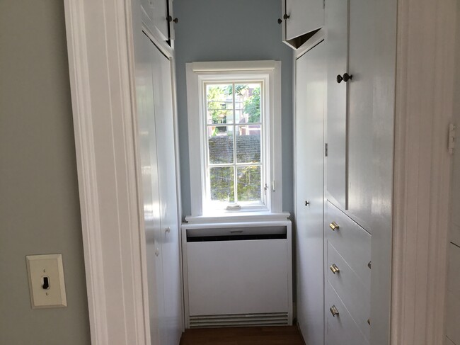 Walk-in closet with 2 closets, drawers, and shelves. - 633 Lafayette Ave