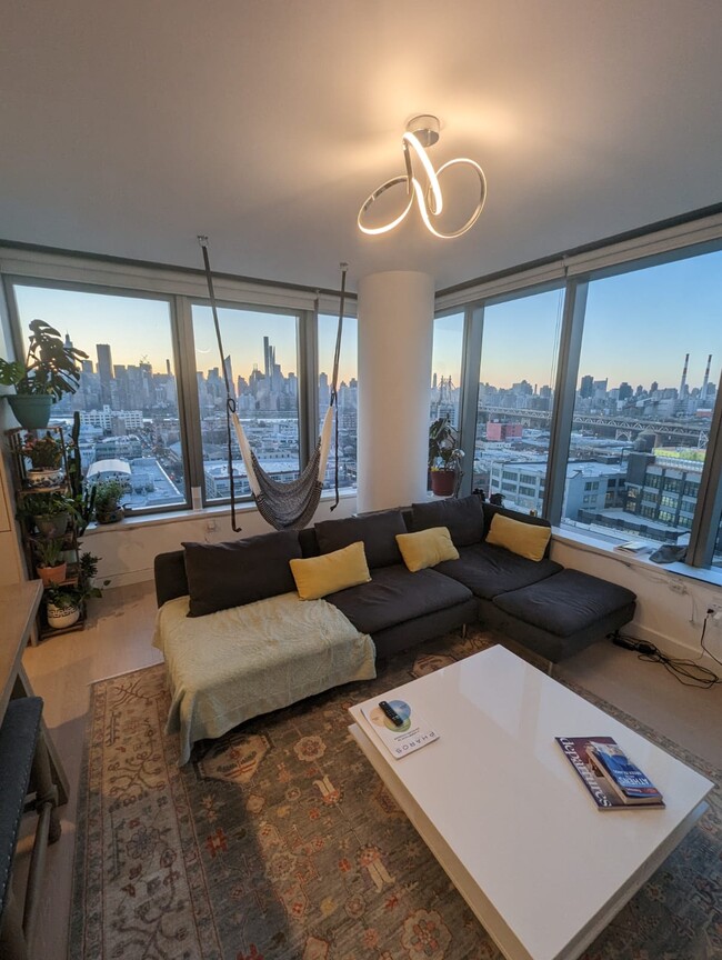 Living room with Manhattan view - 2315 44th Dr
