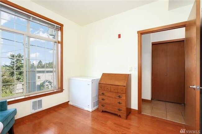 Building Photo - MOVE IN SPECIAL! 2 Bedroom 1 Bath Condo w/HW floors - Secured Garage parking
