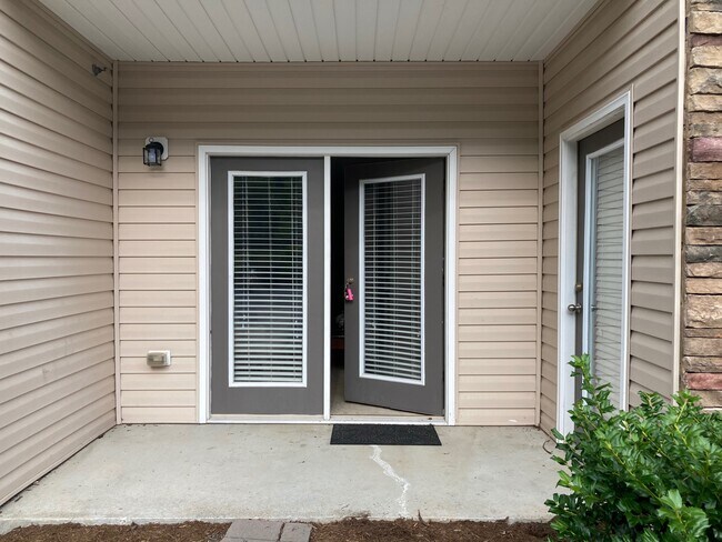 Outdoor seating area, and additional entrance for space available. - 190 Eli Hartley Dr