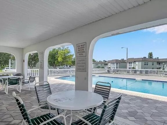 Shaded seating by pool - 1250 S Pinellas Ave