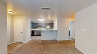 Located at 100 Summerwalk Parkway in Tucker, GA, this one-bedroom, one-bathroom unit offers a thoughtfully designed single-floor layout. The open-concept living and kitchen area forms the heart of the space, where a peninsula breakfast bar with marble-style countertops serves as a natural divider. The kitchen is well-appointed with gray shaker-style cabinetry, subway tile backsplash, stainless steel appliances including a gas range and refrigerator, and light wood-look flooring. A window above the counter brings in natural light. The living area features neutral-toned carpet and clean white walls, creating a bright and versatile space. The bedroom is a comfortable size, with carpet flooring, soft neutral walls, and a door and window that let in natural light and outdoor views. A dedicated closet provides convenient storage. The bathroom is finished with a marble-style vanity top paired with gray cabinetry, a tiled tub-shower combo, and wood-look tile flooring. Textured ceilings and flush-mount lighting are found throughout, giving the space a clean, consistent aesthetic well-suited for comfortable everyday living.