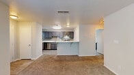 Located at 100 Summerwalk Parkway in Tucker, GA, this one-bedroom, one-bathroom unit offers a thoughtfully designed single-floor layout. The open-concept living and kitchen area forms the heart of the space, where a peninsula breakfast bar with marble-style countertops serves as a natural divider. The kitchen is well-appointed with gray shaker-style cabinetry, subway tile backsplash, stainless steel appliances including a gas range and refrigerator, and light wood-look flooring. A window above the counter brings in natural light. The living area features neutral-toned carpet and clean white walls, creating a bright and versatile space. The bedroom is a comfortable size, with carpet flooring, soft neutral walls, and a door and window that let in natural light and outdoor views. A dedicated closet provides convenient storage. The bathroom is finished with a marble-style vanity top paired with gray cabinetry, a tiled tub-shower combo, and wood-look tile flooring. Textured ceilings and flush-mount lighting are found throughout, giving the space a clean, consistent aesthetic well-suited for comfortable everyday living.
