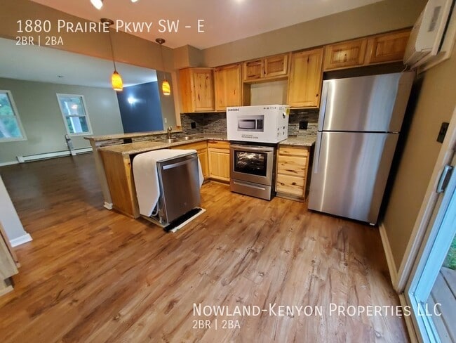 Building Photo - 1880 Prairie Pkwy SW - E- 2 beds, 1 full bath
