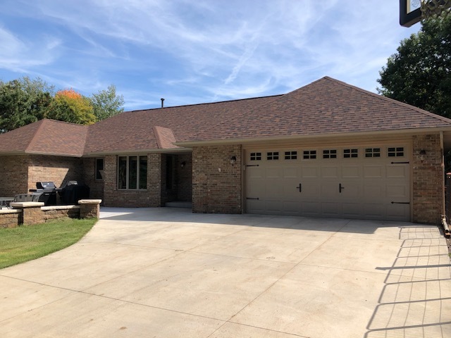 2 car garage on main level - 2 car garage lower level - 9731 110th St N