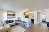 Located at 11500 Green Plaza Dr in Houston, TX, this single-floor, one-bedroom, one-bathroom residence offers a well-organized layout across a compact yet functional footprint. The open-concept living and dining area is bright and welcoming, featuring hardwood-style flooring, large windows, and sliding glass doors that flood the space with natural light while providing outdoor access. The living room offers ample room for comfortable seating arrangements, complemented by a textured ceiling and clean white walls.

The kitchen is efficiently designed with gray cabinetry, a subway tile backsplash, black appliances including a range and refrigerator, and a peninsula counter with bar seating — seamlessly connecting the kitchen to the dining area. An adjacent pantry provides useful additional storage.

The bedroom is a well-proportioned retreat, featuring a window with outdoor views, hardwood-style flooring, and two closets offering generous storage. The full bathroom is conveniently accessible directly from the bedroom.

A hallway connects the living areas to the private quarters, with built-in shelving adding practical storage. The entrance provides a welcoming transition into the home. Throughout the unit, the neutral color palette and consistent flooring create a cohesive, move-in-ready aesthetic.