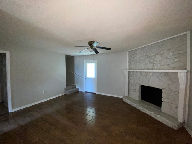 Building Photo - 4BR/2BA Millington Rental with Hardwood Flooring, Rustic Fireplace & Large Yard