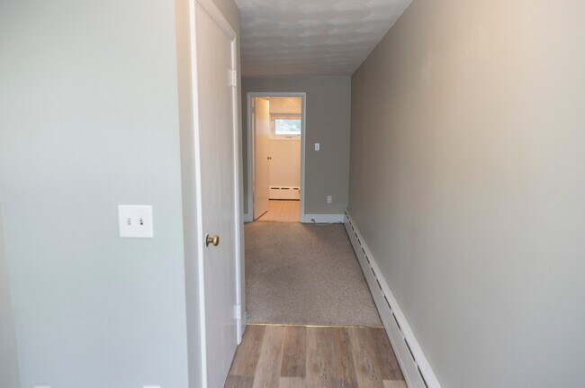 Entrance hallway with closet on left - 61 Brewster Ave