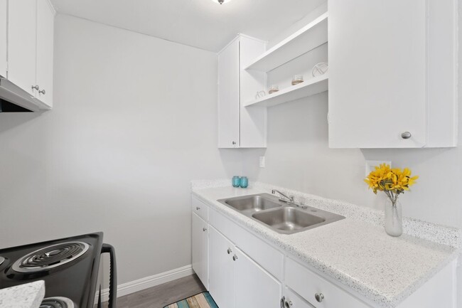 Villa Park a kitchen with white cabinets and a stainless steel sink Interior kitchen view - Villa Park