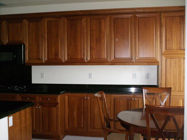 kitchen and breakfast nook - 3415 Archetto Dr