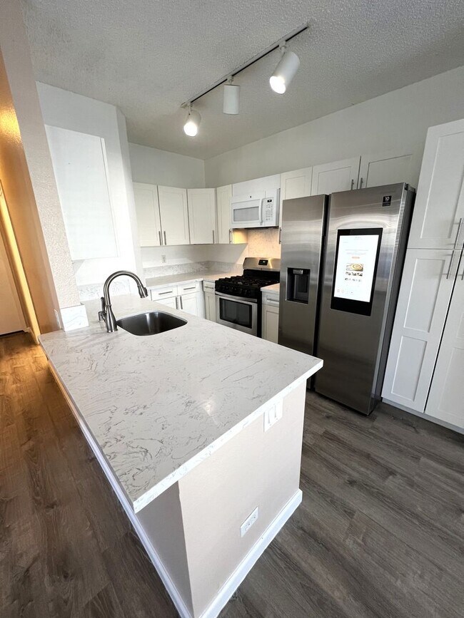 Photo - Palm Court 2 bedroom and 2 bathroom ground floor unit with 2 parking Townhome