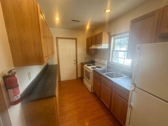 Building Photo - Small Single Family Home With Attached Garage