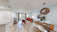 Located at 700 Forest Park Boulevard in Oxnard, California, this well-appointed 3-bedroom, 3-bathroom residence offers a thoughtfully designed single-floor layout. The open-concept living and dining area is bright and welcoming, featuring light wood-style flooring, recessed lighting, and a sliding glass door that opens to a private balcony with outdoor views. A woven pendant light fixture anchors the dining space, adding a distinctive design touch.

The kitchen is outfitted with dark wood cabinetry, marble-style quartz countertops, under-cabinet lighting, and stainless steel appliances including an electric range with over-the-range microwave. The layout supports efficient meal preparation and flows seamlessly into the living area.

The primary bedroom is a comfortable retreat with ample built-in closet space. The additional bedrooms are well-sized, with one featuring dual windows that bring in natural light. Each of the three bathrooms includes a tub-shower combination, with one showcasing a soaking tub.

A hallway connects the private sleeping quarters to the main living spaces, with a dedicated closet providing additional storage. Throughout the residence, neutral tones and consistent flooring create a cohesive and functional living environment.