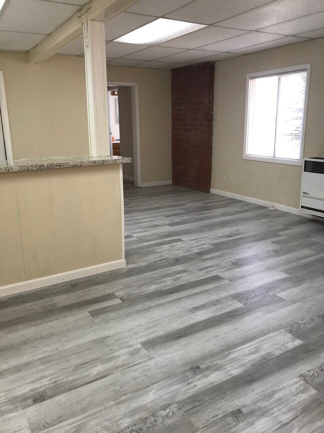 Living room facing dining area - 734 W 25th St