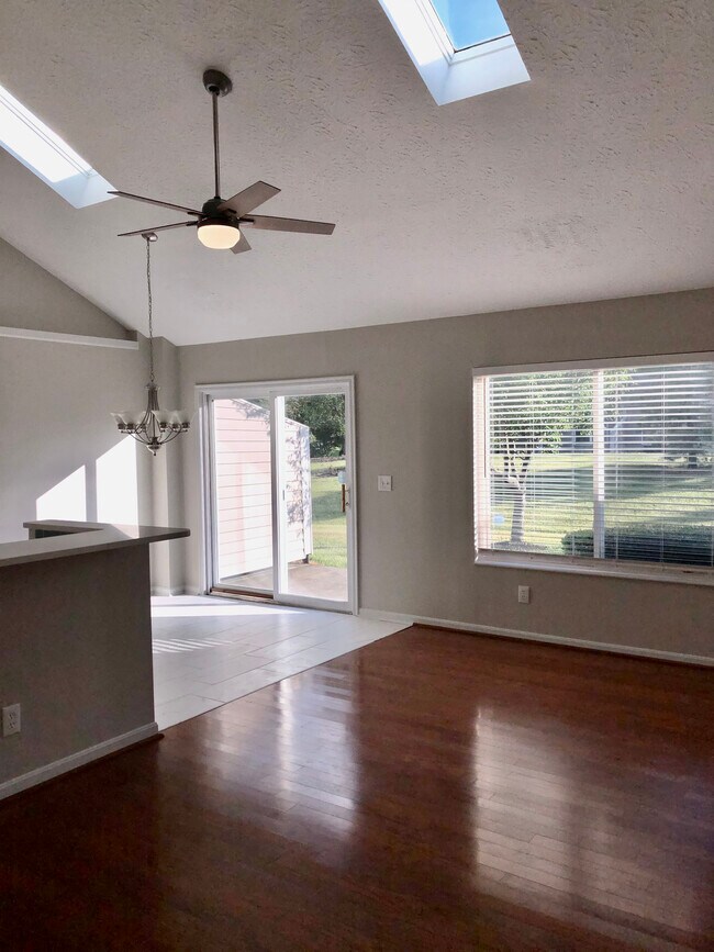 Living and dining areas - 4125 East Village Dr