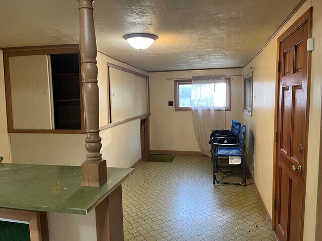 Building Photo - Clean 2 Bedroom home with hardwood flooring & large backyard