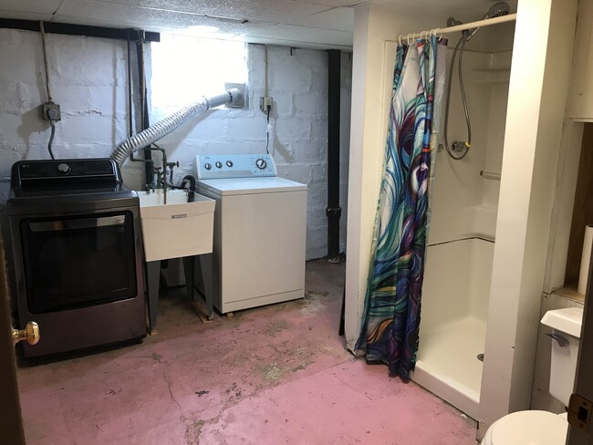 Laundry room and full bathroom within basement. - 108 Dinsmore Ave