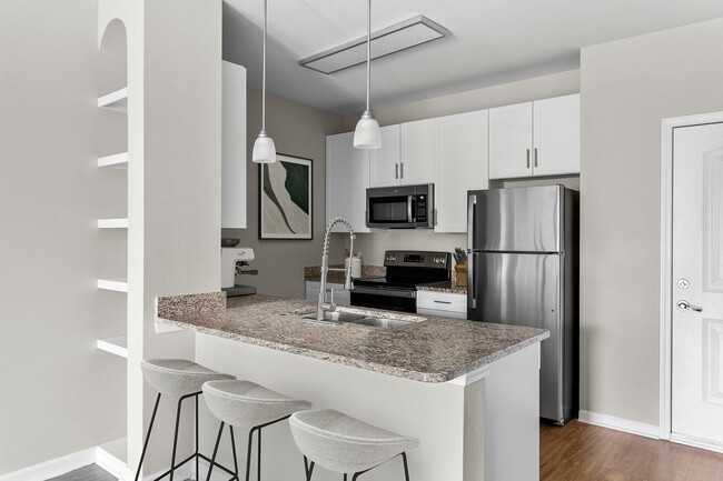 Experience the elegance of this modern kitchen, perfect for culinary creativity. - Addison at South Tryon