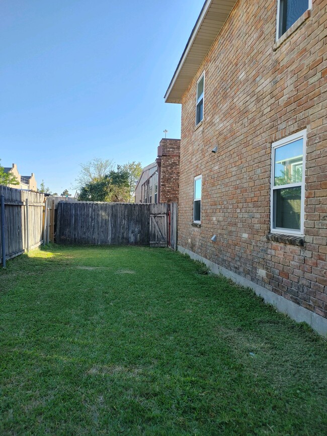 View of Back Yard from Front Entrance - 2801 Houma Blvd