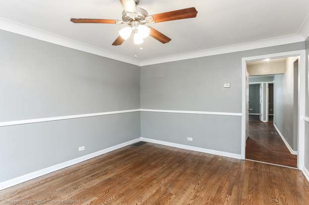 Front Room. Walls are white. - 8122 S Kingston Ave