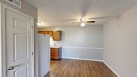 Located at 528 Greenfield Ln in Erlanger, Kentucky, this single-floor unit offers a practical, well-organized layout suited for comfortable everyday living. The open-concept area connecting the kitchen and living space is finished with durable wood-look plank flooring and neutral gray walls, creating a cohesive and easy-to-maintain environment. A ceiling fan with a light fixture serves the living area, contributing to both comfort and functionality.

The kitchen is equipped with warm-toned wood cabinetry extending to the upper walls, light granite-style countertops, a double stainless steel sink, a white electric range, dishwasher, and refrigerator. Ample upper and lower cabinet storage makes the kitchen highly practical for daily use. A textured ceiling is consistent throughout the unit.

The bedrooms feature plush carpeting and neutral wall tones, providing a quieter, softer feel. One bedroom includes a closet with a built-in shelf and rod, while a window with blinds allows natural light into another bedroom. An exterior door is accessible from the main living area.

The bathroom is finished with light tile flooring, a wood vanity with a granite-style countertop, and a clean white tub/shower surround unit, offering a bright and functional space.
