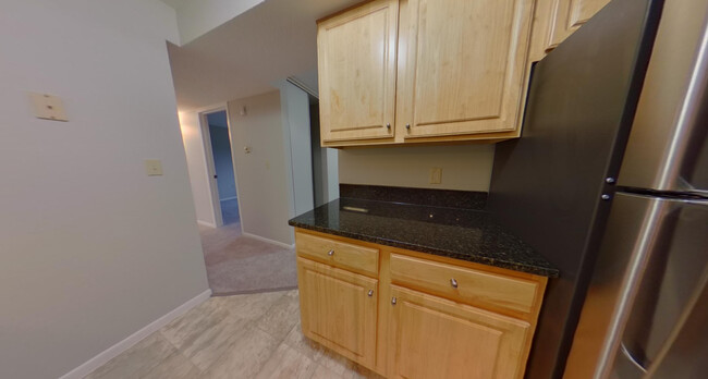 Kitchen/Hallway - St. Clair Woods Apartments