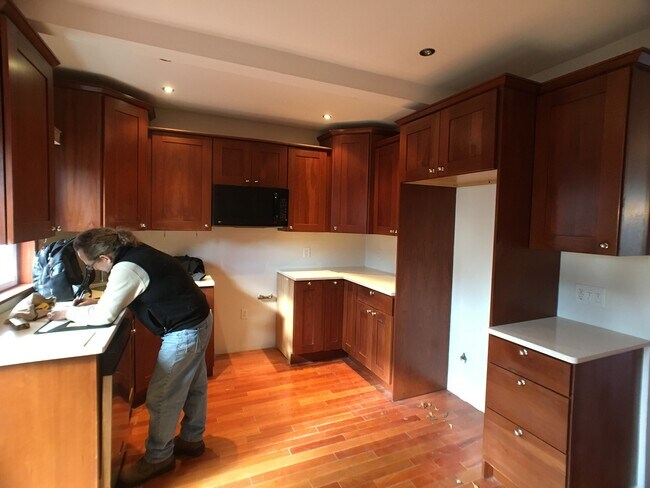Full kitchen with sliding door onto deck. Fridge, dishwasher and stove included. - 28 W 49th St