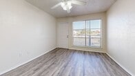 Located at 603 Eagle Dr in Denton, TX, this one-bedroom, one-bathroom unit offers a practical and well-organized single-floor layout. Wood-look luxury vinyl plank flooring runs throughout the space, providing a cohesive and easy-to-maintain finish across every room.

The combined kitchen and living area forms the heart of the unit. The kitchen is equipped with white cabinetry, light granite-style countertops, a double-basin sink, a gas range, a dishwasher, and a full-size refrigerator — offering a complete set of appliances within a compact footprint. The living area benefits from a large window that allows natural light to fill the room, complemented by a ceiling fan overhead. Textured ceilings are present throughout the unit.

The bedroom is a well-proportioned private retreat, featuring its own ceiling fan with light fixture and a door that connects to the kitchen and living area. The bathroom includes a full-size soaking tub and shower combination with white tile surround and chrome fixtures, keeping the space clean and functional.

Neutral wall tones and consistent flooring throughout create a unified, move-in ready aesthetic. This unit is well-suited for individuals or couples seeking a straightforward, functional living space in Denton, TX.