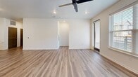 Located at 1200 Duff Dr in Fort Collins, Colorado, this well-appointed three-bedroom, two-bathroom residence offers a thoughtfully designed single-floor layout with a clean, contemporary aesthetic. Light-toned luxury vinyl plank flooring flows consistently throughout the home, complementing the neutral white walls and modern gray-toned interior doors.

The open-concept kitchen and living area serves as the heart of the home, featuring flat-panel light wood cabinetry, stainless steel appliances, a subway tile backsplash, and a generous granite-topped island with an integrated sink — ideal for both everyday meals and entertaining. Recessed lighting and a ceiling fan keep the living space bright and comfortable.

The primary bedroom offers a comfortable footprint with natural light from large windows, and is complemented by a walk-in closet with multi-tier wire shelving. The en-suite bathroom includes a wood-toned vanity, granite countertop, and a well-lit mirror. Secondary bedrooms feature light-filled windows and double-door closets. A dedicated in-unit laundry area accommodates a full-size washer and dryer.

A private balcony with black metal railings provides outdoor space with views of the surrounding community, lush greenery, and the Colorado sky — a welcoming retreat in this modern Fort Collins residence.
