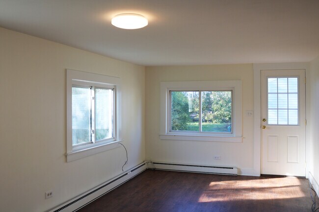 Open concept kitchen/living area with new flooring. - 34A Royal Ave