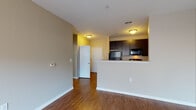 Located at 600 Marshall St in Louisville, Kentucky, this single-floor residence offers a thoughtfully designed layout that balances functionality with comfort. Warm hardwood flooring flows throughout the main living areas, creating a cohesive and inviting atmosphere.

The open-concept living area is bright and spacious, benefiting from a large window fitted with blinds that allows natural light to fill the room. A ceiling fan adds both style and practicality to the space. This area connects seamlessly to the kitchen via a half-wall peninsula, making it ideal for everyday living.

The kitchen features a galley-style configuration with dark espresso cabinetry lining both sides, providing generous storage. Light-toned countertops offer ample prep space, and the kitchen is equipped with stainless steel appliances including a microwave, alongside a built-in range and dishwasher.

The bedroom is a quiet, carpeted retreat with its own ceiling fan and a window offering views of the surrounding Louisville neighborhood. The bathroom is clean and functional, complete with a full soaking tub and shower combination, tile flooring, and neutral-toned walls that contribute to a calm, understated aesthetic.

The overall design of the space is modern yet approachable, with neutral wall tones and consistent finishes throughout that create a move-in-ready environment in the heart of Louisville.