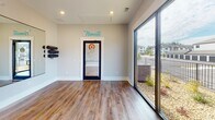 Located on Pointe Grand Drive in Augusta, Georgia, this single-floor yoga and fitness studio is thoughtfully designed to support movement, mindfulness, and wellness. The open layout provides generous floor space finished with warm hardwood-style flooring, creating a clean and inviting environment well-suited for yoga, stretching, and group exercise.

A standout feature of the studio is the large floor-to-ceiling mirror that spans one wall, allowing practitioners to monitor their form and making the space feel even more expansive. Complementing this are oversized sliding glass doors that flood the interior with natural light and offer unobstructed views of the surrounding landscaped grounds, contributing to a calm, connected atmosphere.

The studio is equipped with a wall-mounted barre rail for balance and flexibility work, as well as a rack of exercise balls in varying sizes. Motivational wall graphics in bold orange circles display wellness-focused quotes, reinforcing the space's mindful character. The "Namaste" script displayed prominently on the wall further establishes the studio's identity. Recessed ceiling lighting provides consistent, even illumination throughout, ensuring the space is fully functional at any time of day.