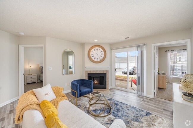 Living Room with Fireplace and Woodgrain Flooring - Reserve at Hamburg