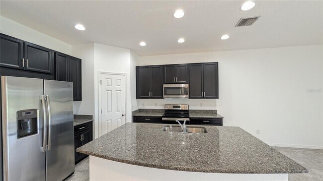 Foto del edificio - 7046 Grand Elm Dr
