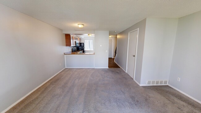 2BR, 1.5BA - 1,100SF - Living Room/Dining Area - North Shore Townhomes