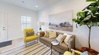 Located in Magna, Utah, this three-story home offers a thoughtfully designed layout spread across multiple levels, providing distinct zones for living, dining, and resting. The main living area features light hardwood flooring, recessed lighting, and a bright, neutral palette that creates a welcoming ambiance. The kitchen is a standout space, equipped with white shaker-style cabinetry, quartz countertops, stainless steel appliances including a gas range, dishwasher, and side-by-side refrigerator, all complemented by the warm hardwood floors that continue throughout. Adjacent to the kitchen, the dining area benefits from a large window that invites natural light and overlooks the surrounding landscape. The living room offers a comfortable retreat with recessed lighting and generous floor space. Both bedrooms are carpeted and serene, with the primary bedroom offering ample room and closet space. The second bedroom is cozy and well-proportioned. Two full bathrooms feature white vanities with clean countertops and tub-shower combinations. With five closets distributed throughout, storage is plentiful. The multi-floor layout, modern finishes, and cohesive design make this a functional and stylish home.