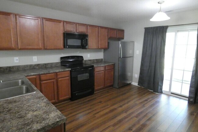 Building Photo - Two Bedroom Two and Half Bathroom End Unit...