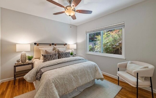 Bedroom with view of garden greenery - 5825 Thornhill Dr