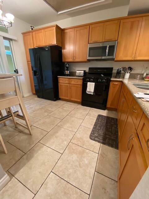 kitchen with gas stove, microwave, refrigerator - 4512 Workman Mill Rd