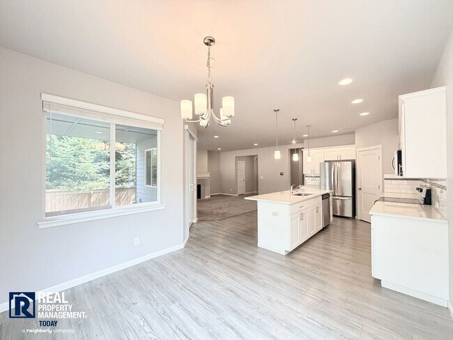 Building Photo - Easy JBLM Commute Like-New 4BR Home with 3-Car Garage & Bonus Office