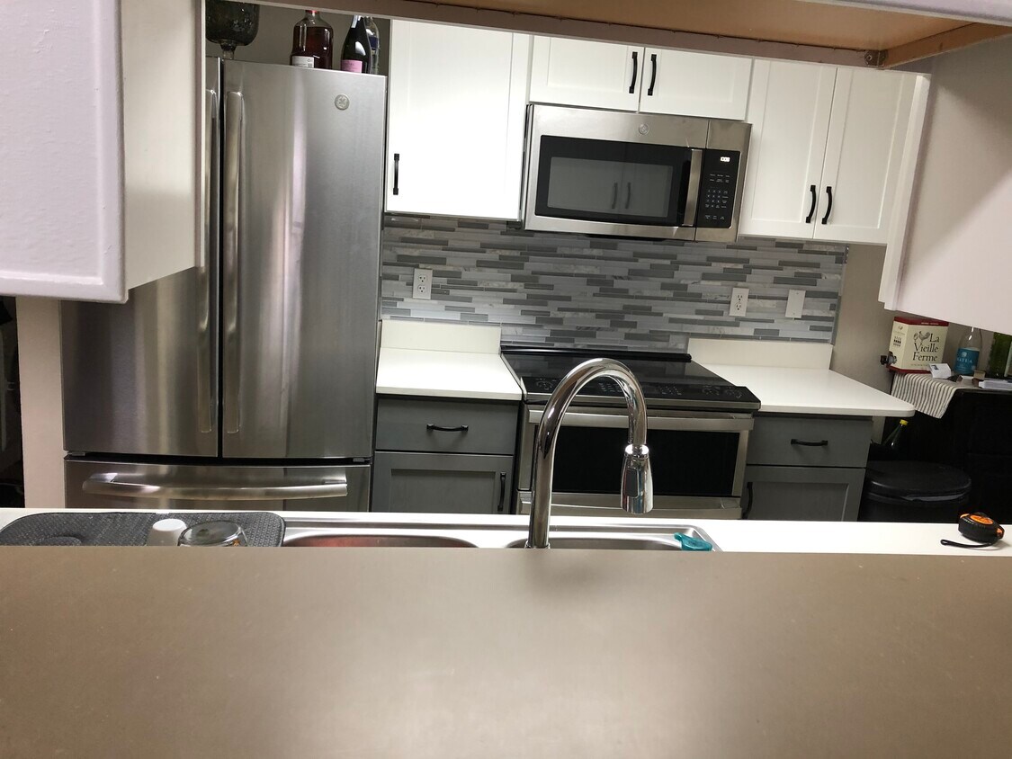 Updated kitchen (stove different than shown) - 6570 E Mississippi Ave