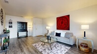 Located at 8574 Jamestown Dr in Winter Haven, FL, this single-story home offers a well-organized, functional layout with consistent hard-surface flooring throughout the main living areas and a warm, neutral color palette on the walls.

The living room is an inviting space, featuring wood-look flooring, a sliding glass door with vertical blinds that opens to an outdoor patio, and ample natural light. The open layout connects seamlessly to the dining area, which includes a corner window that brings in additional natural light and overlooks a landscaped exterior.

The galley-style kitchen is efficiently designed with warm honey-toned cabinetry, white appliances including a refrigerator and dishwasher, generous counter space, and a direct sightline into the dining area.

The bedroom is carpeted and well-lit, featuring a window with blinds and closet access. The full bathroom is clean and functional, offering a vanity with a large mirror, wood-look flooring, and a shower-tub combination.

A transitional hallway area connects the main living spaces to the private quarters, featuring additional storage and decorative wall space. The home's single-floor design ensures easy accessibility throughout, making it a practical and comfortable residence in the heart of Polk County.