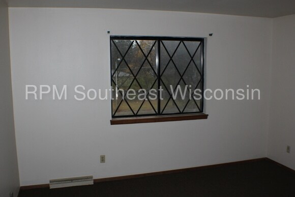 Building Photo - 6011 W Port Ave