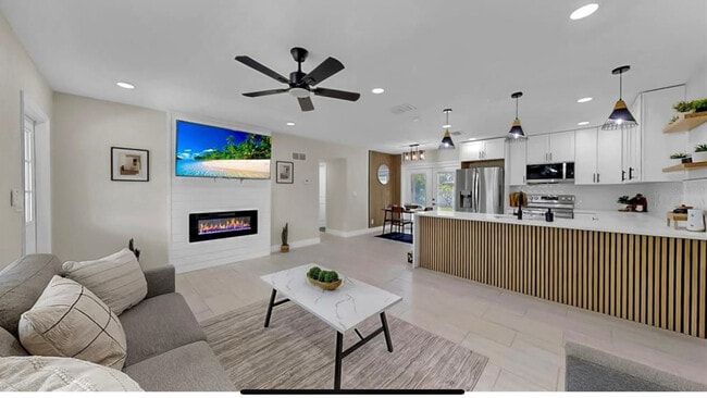 Open concept living room with fireplace - 636 41st Ave NE