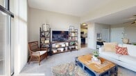 Located at 701 Harrison St in Allentown, PA, this one-bedroom, one-bathroom unit offers a well-designed, single-floor layout that makes efficient use of its space. The living area is divided into two distinct zones — a main lounge area with plush carpeting, a ceiling fan, and a dedicated dining nook, and a sun-filled secondary sitting area anchored by large sliding glass doors that open to a private balcony overlooking lush greenery. Natural light pours throughout, creating a bright and welcoming ambiance. The kitchen is equipped with stainless steel appliances including a refrigerator, dishwasher, and range, complemented by white shaker cabinetry, granite-style countertops, and durable wood-look flooring. The generously sized bedroom features soft carpeting, neutral tones, and a window that continues the unit's theme of natural light. A closet and easy access to the full bathroom add to the bedroom's functionality. The bathroom includes a tub-shower combination, a vanity with white cabinetry, and warm wood-style flooring. Clean lines, neutral color palettes, and a cohesive design throughout make this a comfortable and practical living space.