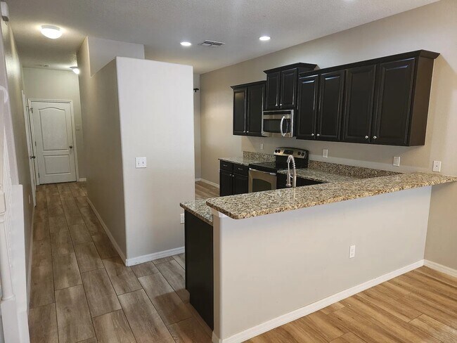 Building Photo - 9516 Trumpet Vine Loop