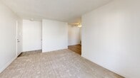 Located at 3535 Marconi Ave in Sacramento, CA, this one-bedroom, one-bathroom unit offers a well-organized single-floor layout designed to maximize functionality. The living room is bright and open, featuring neutral carpet, crisp white walls, a textured ceiling, and sliding glass doors that lead to a private balcony with outdoor views. Adjacent to the living area, a dedicated dining space provides a natural flow for everyday living and entertaining. The galley-style kitchen is efficiently designed with white cabinetry, granite-look countertops, full appliances including a refrigerator and electric range, a dishwasher, and a window that brings in natural light. Wood-look flooring runs throughout the kitchen and hallway, complementing the soft carpet in the living and sleeping areas. The bedroom is a comfortable, well-proportioned retreat with a large window overlooking greenery, providing a peaceful atmosphere. Three closets throughout the unit offer generous storage options. The bathroom features a tub-shower combo with tiled surround, a vanity with granite-look countertops, and wood-look tile flooring. Additional spaces include a utility room, entrance, and hallway, completing this practical and move-in-ready Sacramento residence.
