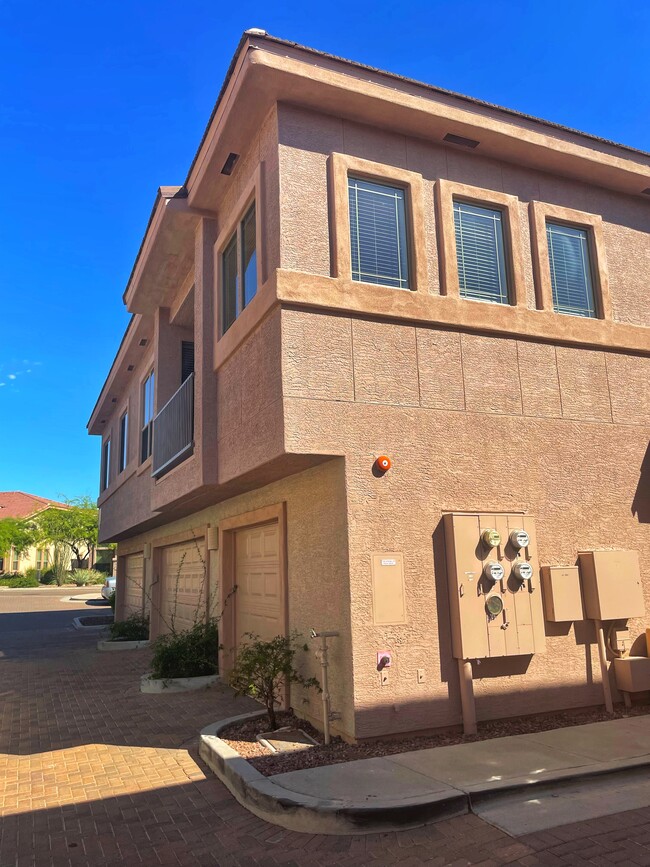 Exterior of unit with garage below and outside, assigned parking space - 42424 N Gavilan Peak Pky