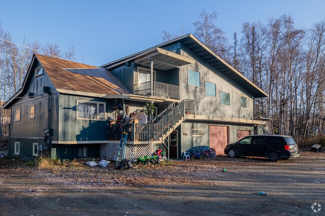 A mid-century modern home with a slanted roof in Wasilla.